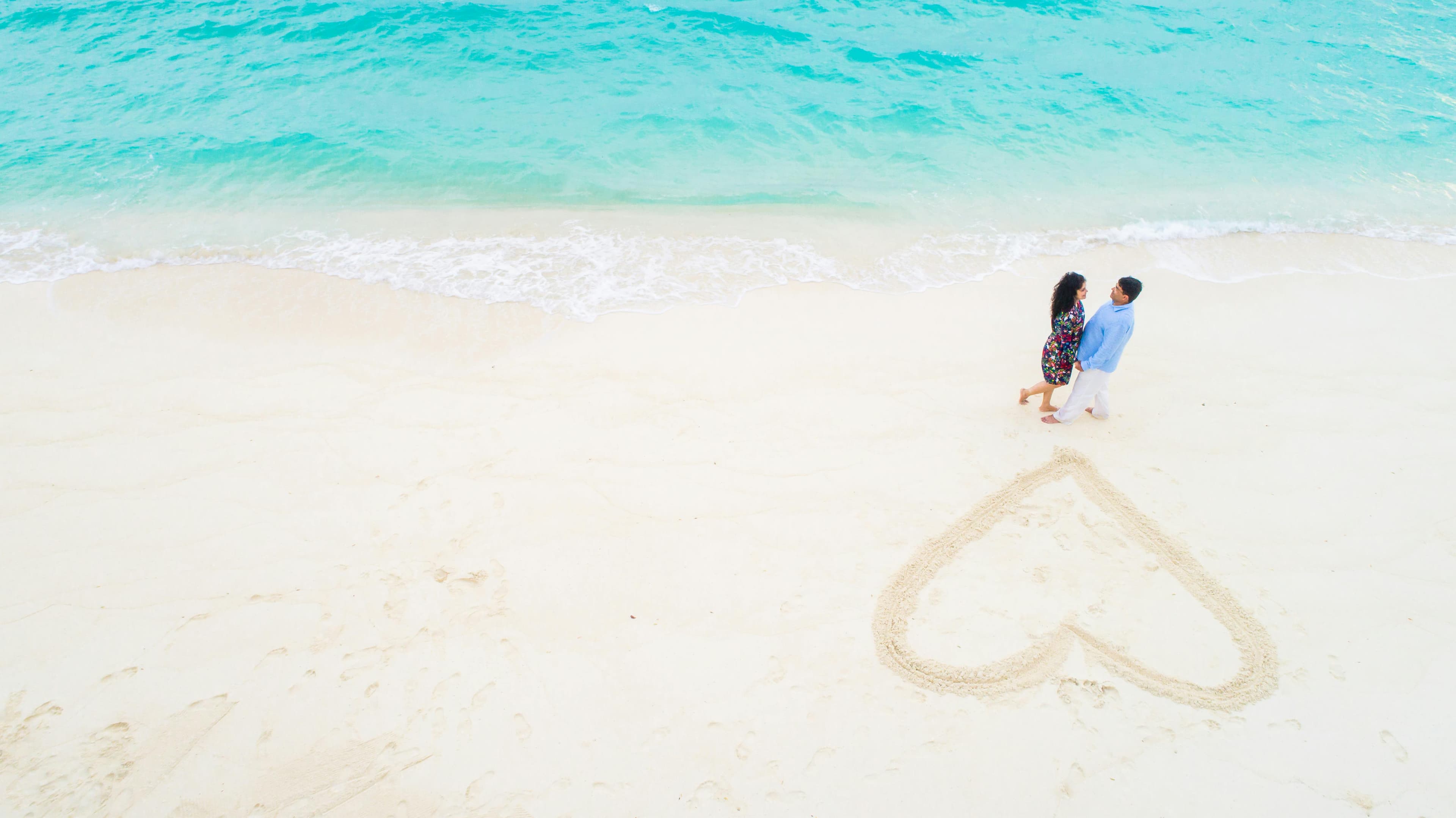Couple walking on beach